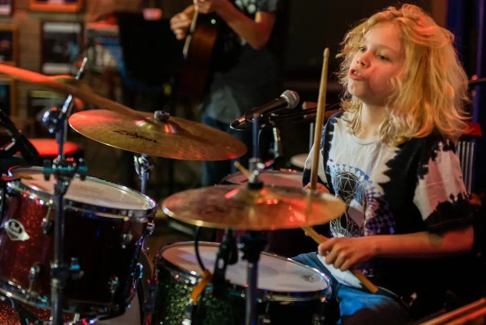 student playing drums