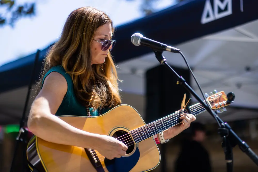 adult student playing guitar