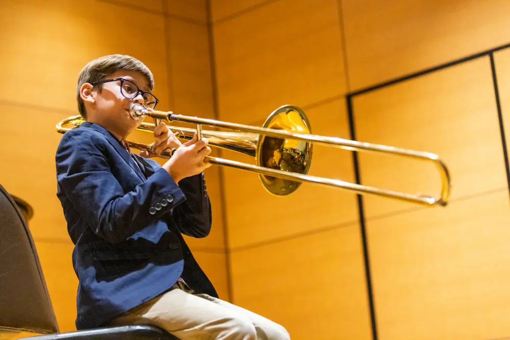 student playing trombone