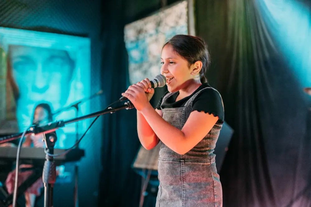 student singing on stage