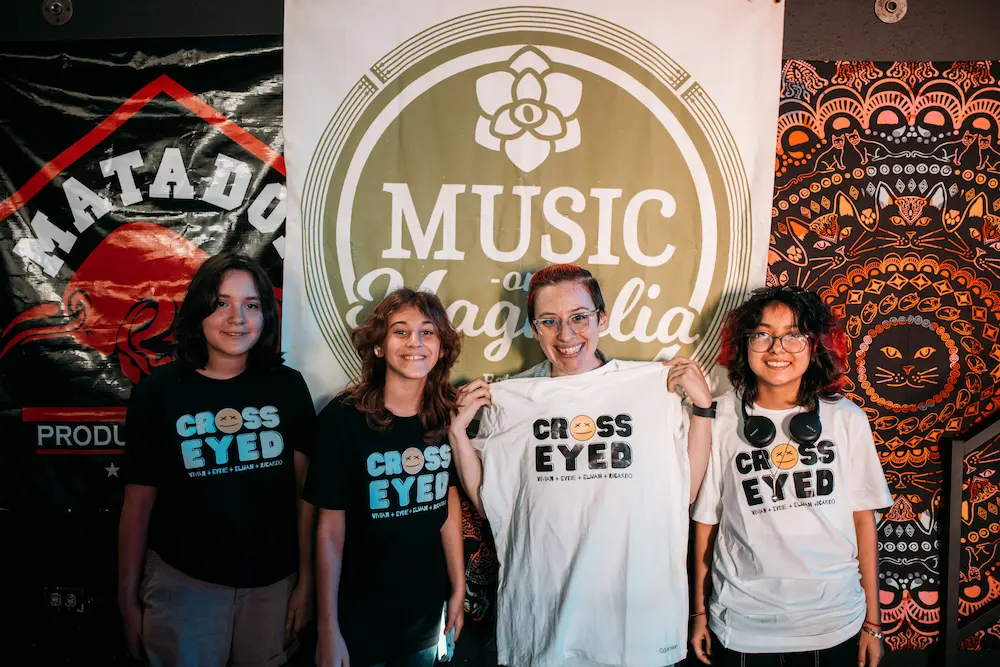 Band members wearing custom band t-shirts