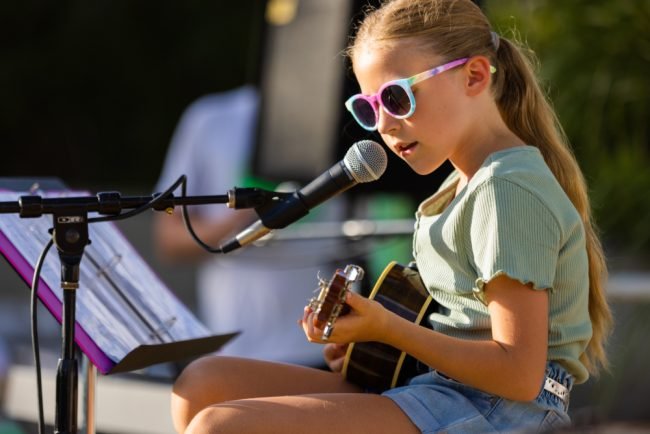 girl playing ukulele