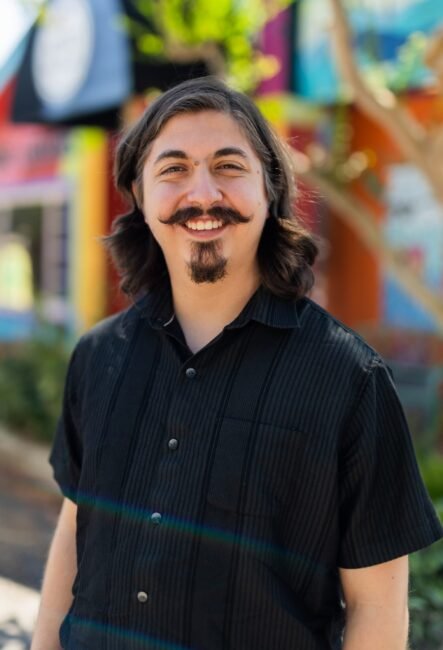 Man in front of building