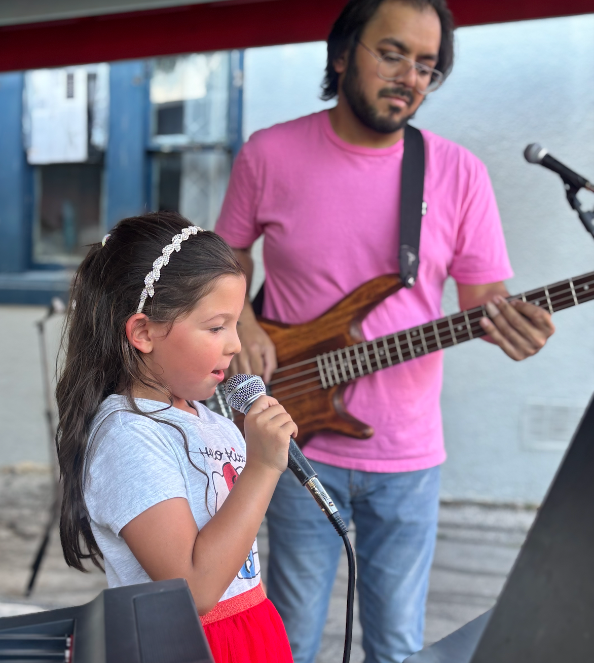 kid and guy singing