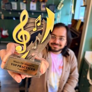 man holding trophy that says top practicer